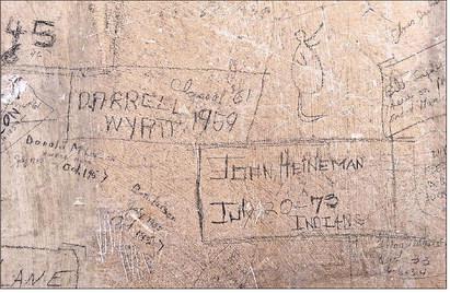 Darrell Wyatt was looking ahead to being a member of the class of ‘61 back when he signed the wall in ‘59 while John Heineman was showing school pride in ‘73