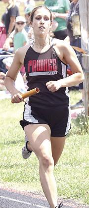 P.C.’s Logan Maloley carries her leg of the girls’ 3200 M. Relay.