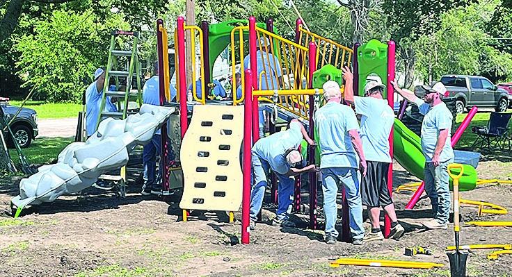 After the poles where placed everyone chipped in the help assemble the equipment. The new park equipment should be ready for play on July 19.