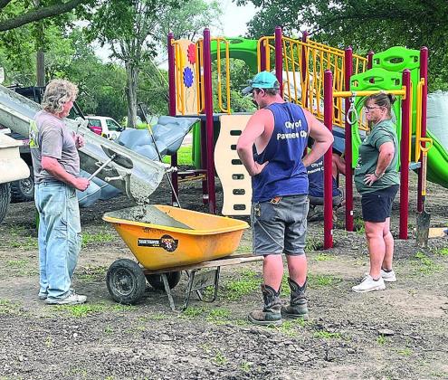 On Tuesday of this week Pete Binder added concrete with the help of Spencer Cumley, Lucas Barloon (hidden) and a very hands-on city council member, Susan Eisenhauer.