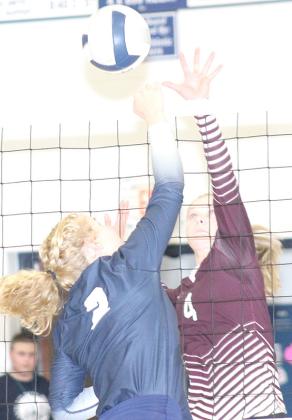 HTRS’ Elie Bstandig (#2, left) and Lewiston’s Emma deKoning (#4, right) go up strong at the net. Paula Jasa/Republican