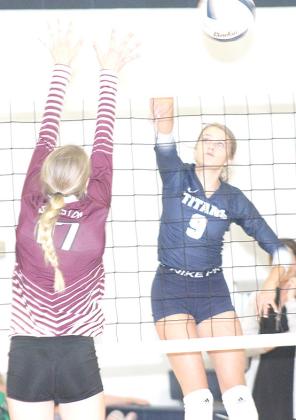 HTRS’ Avery Dierberger (#9, right) launches a spike past LHS’ Meagan Sanders (#17, left). Paula Jasa/Republican