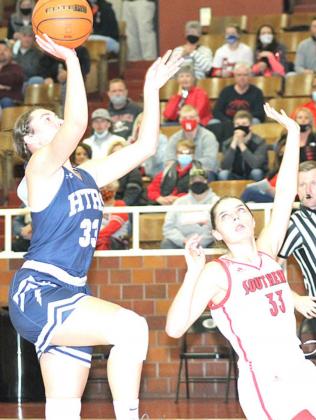 HTRS’ Natalie Novak (#33, left) goes in for a quick two points against W-S in the Championship game. Paula Jasa/Republican