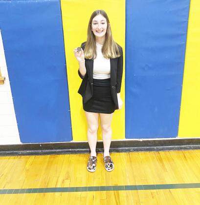 Kierstin Rehrs and her 2nd place district medal in entertainment speaking.