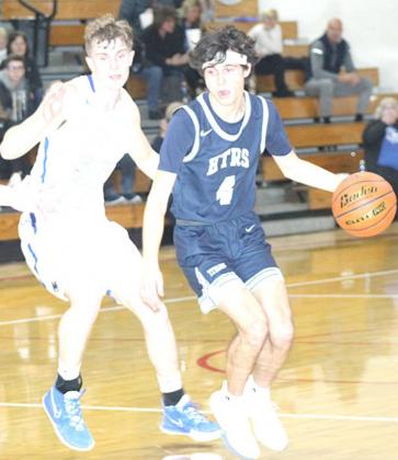 HTRS’ Nic Knudson (#4, right) drives past an NCL defender in early action on Thursday night. Paula Jasa/Republican