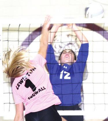 LHS’ Emma Engwall (#1, left) puts down a kill past a CVA blocker in last Tuesday’s game. Paula Jasa/Republican