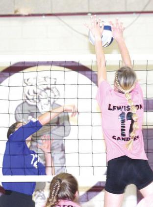 LHS’ Meagan Sanders (#17, right) gets her hands on an ace block against CVA in last week’s game. Paula Jasa/Republican