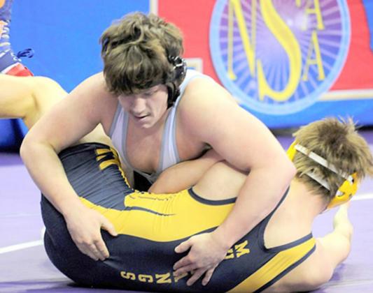 HTRS/P.C.’s Aiden Worthey takes on Ord’s Ryan Gabriel in the Championship match (left) and Raymond entral’s Mason Kreikemeier (above) in the first round. photos courtesy of Luke Nichols/Beatrice Daily Sun