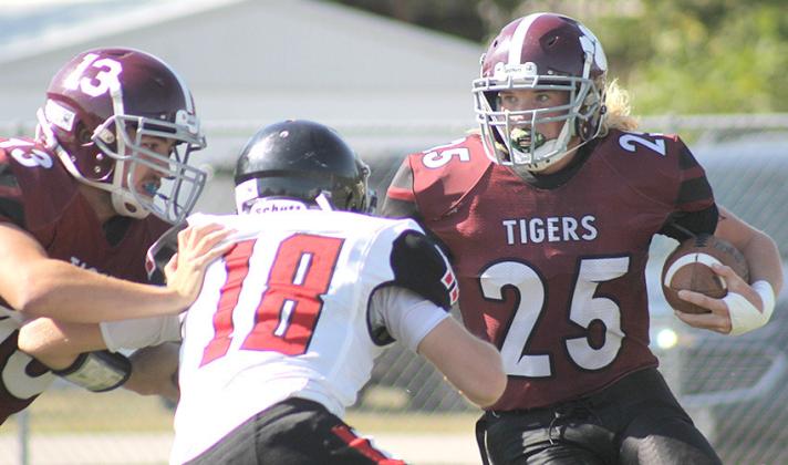 LHS’ Tristen Ray (#25, right) waits for teammate Brady Bledsaw (#13, left) to block for him on one of his runs down the field. Ray led the Tigers with 213 yards rushing. Paula Jasa/Republican