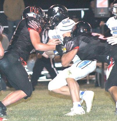 P.C.’s Jesse McLaughlin (left) and Atreyu Kling (#2, right) combine for a stop in Friday night’s game. Paula Jasa/Republican