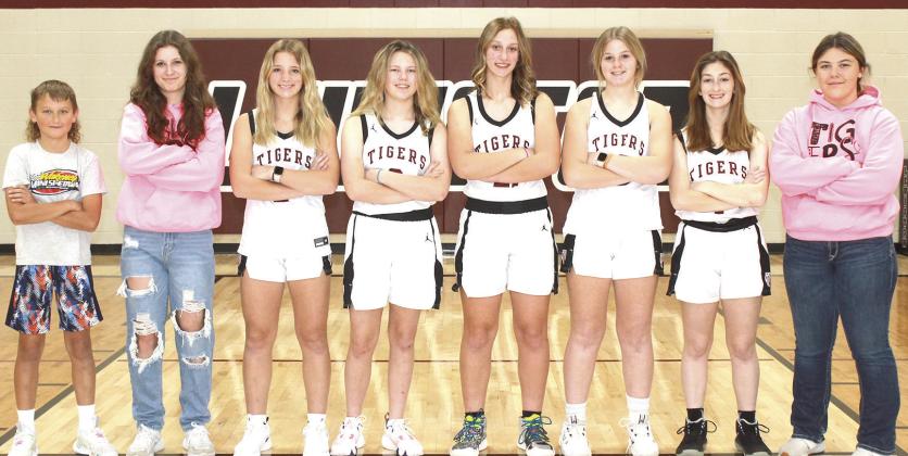 Members of the 2023-24 Lewiston Girls’ Basketball Team are from left: Braxten Eagleburger, s.m., Savannah Cutshall, s.m., Justice Currie, Ayden Hunzeker, Maddie Janssen, Delanye Currie, Kierstin Rehrs, Bryleigh Crouse, s.m. Not pictured: Sara Wiles, Head Coach Matt Sholty, Asst. Coach Kohlton Gabehart.