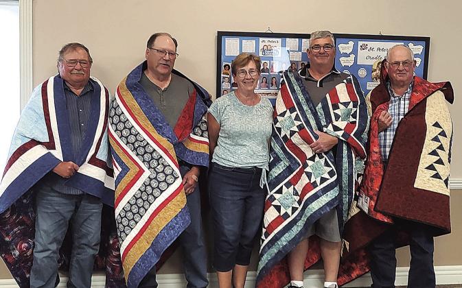 Jeanette Beethe Heins made and presented quilts of valor to four of her cousins at the Beethe family reunion this summer. Pictured are Marvin Luedders of Burchard, Donald Luedders of Pawnee City, Jeanette Heins of David City, Mark Beethe of Exeter, and Howard Beethe of Tecumseh. Marvin, Howard, and Donald all served in the Army Reserves in the 60’s and 70’s, and Mark served in the National Guard in the 80’s