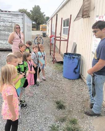 Above, Cayd Wilgers talks to the Kindergarten about ATV safety. Kindergarten (front to back) Peyton Keedy, Colton Brethouwer, Liam Cookus, Ellie Campbell, Nolan Janssen, Tristan Bombard, Sophia Meyer, Lelan Leitschuck, teacher Mrs. Tracie Wehrbein