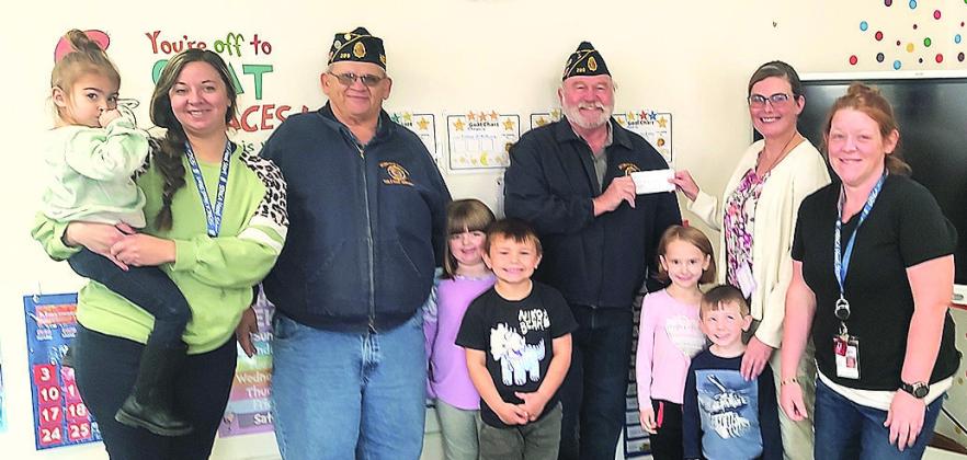 $500 dollar donation from the Table Rock American Legion to the Headstart Program for them to buy toys for the kids. With Jerry Vrtiska and Gregg Clement.