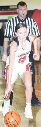 Pawnee City’s Kinsley Benson (#12) brings the ball down the floor.