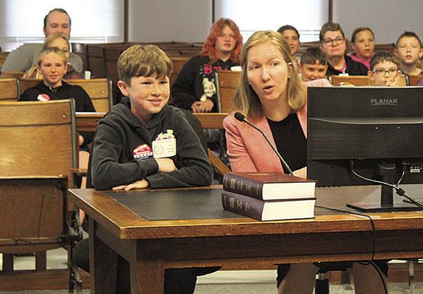 Pawnee County Attorney Emily Sisco consults with her cocounsel, an HTRS 5th grader