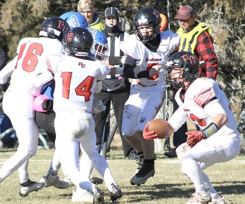 photo courtesy of Jamie Maloley P.C.’s Andy Maloley (#12, right) makes a move behind his blockers including Anthony Kling (#16, left, Jett Farwell #14 and Justin Pierce (#5). Maloley led the Indians with 22 carries for 167 yards and 4 TD’s.