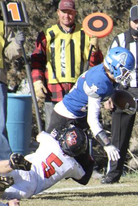 P.C.’s Justin Pierce (#5) makes a tackle on an Arthur ball-carrier. Pierce had 5 tackles in the game. photo courtesy of Jamie Maloley