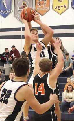 HTRS’ Emmett Glathar draws a foul against Falls City on Thursday night. Glathar topped out in scoring for HTRS with 26 points against the Tigers. Paula Jasa/Republican