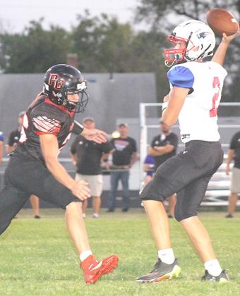 12 tackles and 1 fumble recovery in the game. P.C.’s Trey Marteney (#12, left) gets in the quarterback’s face once again against Parkview. Marteney had Paula Jasa/Republican