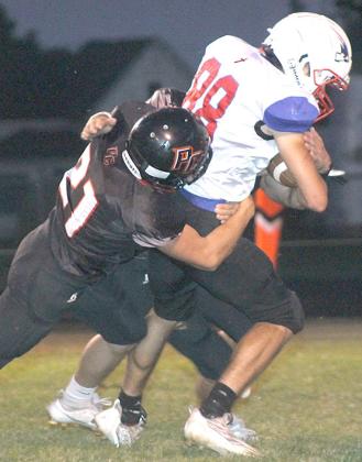 P.C.’s Wyatt Blank records one of his 7 tackles against a Parkview ball-carrier in Friday night’s victory. Paula Jasa/Republican