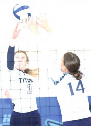 HTRS’ Macy Vrtiska (#3, left) goes up for a block against Freeman. Paula Jasa/Republican