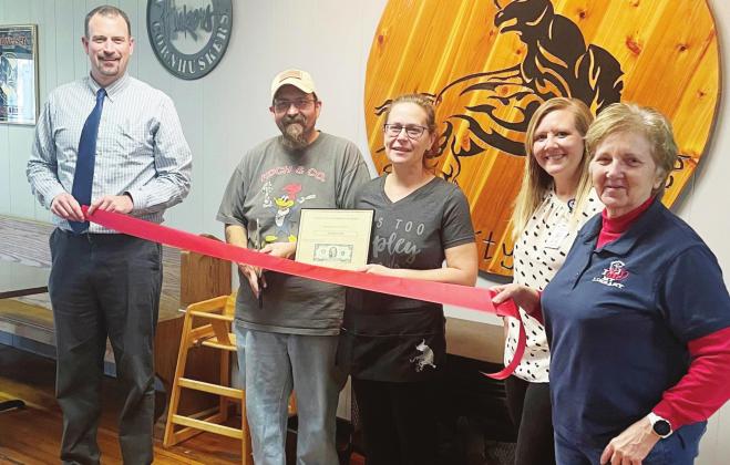 The Chamber of Commerce held a ribbon cutting ceremony for the Blazin Bull last Tuesday. From left are Chamber President Brian Rottinghaus, owners Tony Moore and Tina Moore, Katrina Olberding from the hospital/clinic and Lola Seitz with the chamber. Ray Kappel/Republican