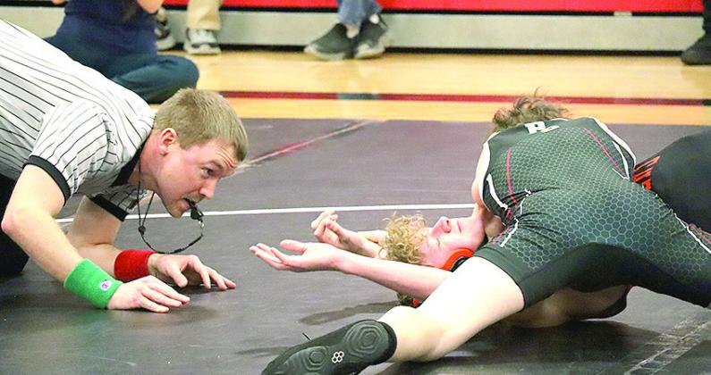 P.C.’s Luke Hunzeker (on top, right) gets the pin against a Falls City opponent. Paula Jasa/Republican