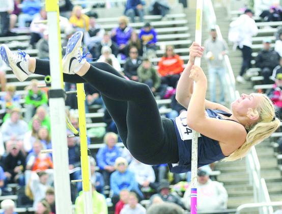 HTRS’ Elie Bstandig goes up and over the bar in the Class D girls’ Pole Vault on Friday. She cleared 8’0” in the event. Photo courtesy of Luke Nichols/Beatrice Daily Sun