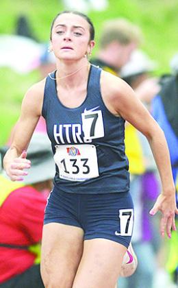 HTRS’ Lillian Bowen comes around the corner of the Class D girls’ 400 M. Dash on Friday. Lillian also ran in the 800 M. Run on Saturday and placed 6th with her new school record time of 2:26.80. Photo courtesy of Luke Nichols/ Beatrice Daily Sun