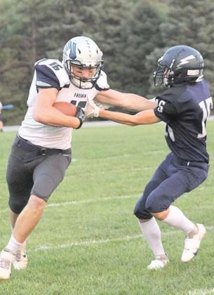 HTRS’ Ethan Dierberger (#15) goes for the tackle against Freeman’s quarterback who scored most of the Falcons’ touchdowns. Paula Jasa/Republican
