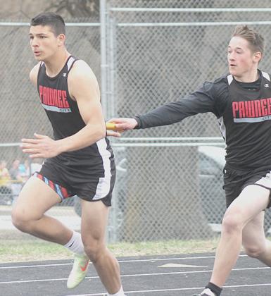 Paula Jasa/Republican P.C.’s Trey Kling (left) takes the handoff from Indian teammate Jesse McLaughlin in the boys’ 400 M. Relay.