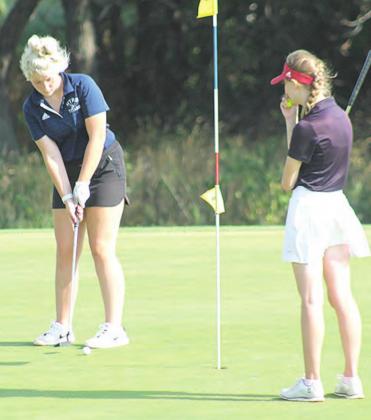 HTRS’ Mikkayla Flynn (left) watches her putt roll towards the #3 hole on Monday morning. Paula Jasa/Republican