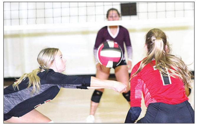 P.C.’s Madison Fender (#3, left) and Ashlynn Hartman (#1, right) get down and ready on serve receive. Paula Jasa/Republican