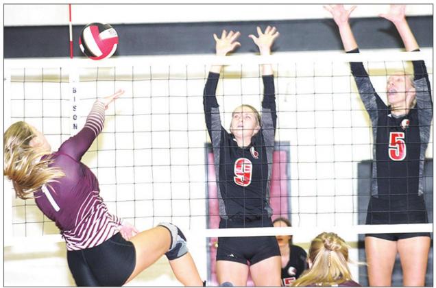LHS’ Emma Engwall (#1, left) goes for a spike down the line as Pawnee City’s Madison Lytle (#9, center) and Sierra deKoning (#5, right) defend at the net. Paula Jasa/Republican