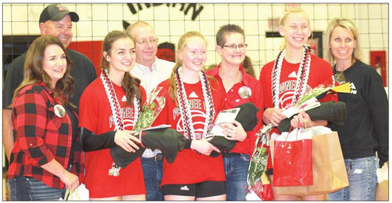 P.C’s three seniors from left, Larissa Tegtmeier, Ashlynn Hartman and Sierra de-Koning celebrate Volleyball Senior Night with their family members. Paula Jasa/Republican