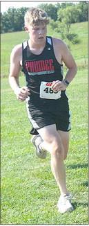 Pawnee City’s Cael Johnson (left) strides up the hill at the Johnson County Central Cross Country Invitational which was held on Friday, September 1st. Cael tied for 40th place at the meet. Photo courtesy of Heidi Koster