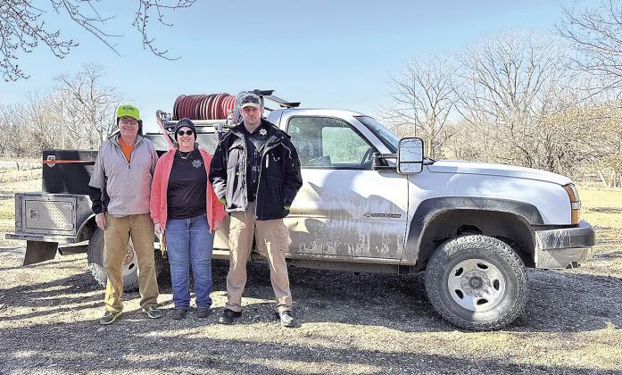 The stolen grass rig has been recovered and towed back to Pawnee County. Pictured L to R: Gary Leatherman, Crime Analyst Nancy Tilton, Sheriff Braden Lang photo by Courtney Kosiski
