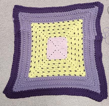 Your blanket should look similar to this by the end of this section. I ran out of one purple and had to switch part way through.
