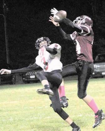 Pawnee City’s Kylenn Koester (#3, left) knocks away a pass intended for Lewiston’s Caleb Rule (#14, right) in Thursday night action. Paula Jasa/Republican