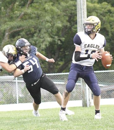HTRS’ Jonathan Koch (#54) works his way into the backfield to go after OCA’s quarterback. Koch hurried the quarterback several times and had 5 tackles. Paula Jasa/Republican
