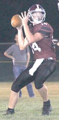 LHS’ Caleb Rule (#14) looks downfield for an open receiver in Friday night’s game against Wilcox- Hildreth. Paula Jasa/Republican