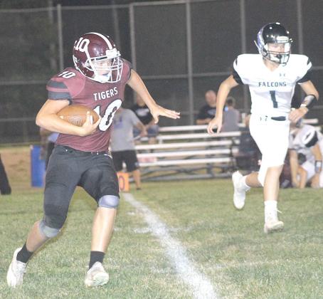 Lewiston’s Everett Bohling (#10, left) takes off on a kickoff return against the Wilcox- Hildreth Falcons on Friday night. Lewiston was outmatched against the undefeated Falcons and lost by a 14-51 score. Paula Jasa/Republican