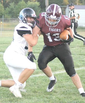 Lewiston’s Brady Bledsaw (#13, right) picks up a big chunk of yardage against the Falcons on Friday night. Paula Jasa/Republican