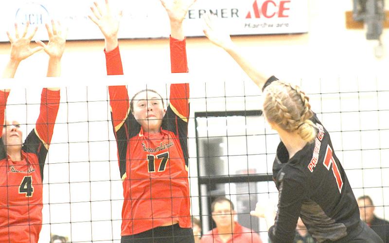 Pawnee City’s Adrian deKoning (#7, right) powers a spike past two JCC defenders in Thursday night’s game. Paula Jasa/Republican