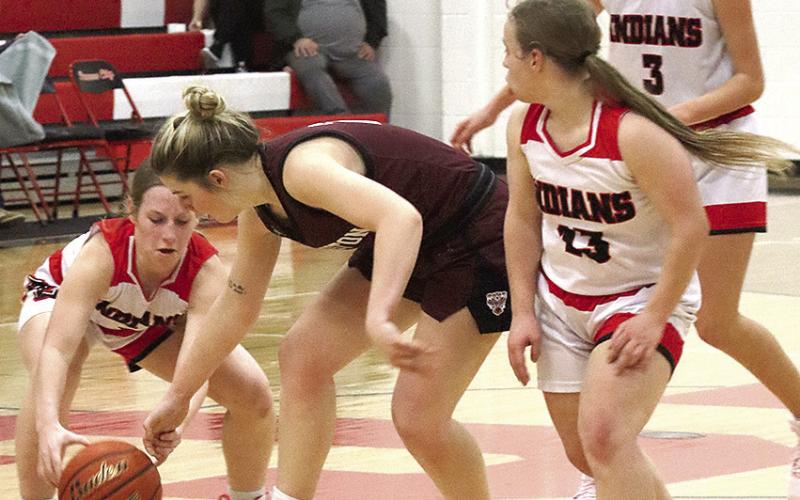 P.C.’s Cara Pierce (left) goes after the ball as LHS’ DeLanye Currie (center) brings down the ball against P.C.’s press. Also pictured are P.C.’s Ericca Gyhra (#13) and Kinsley Benson (#3). Paula Jasa/Republican