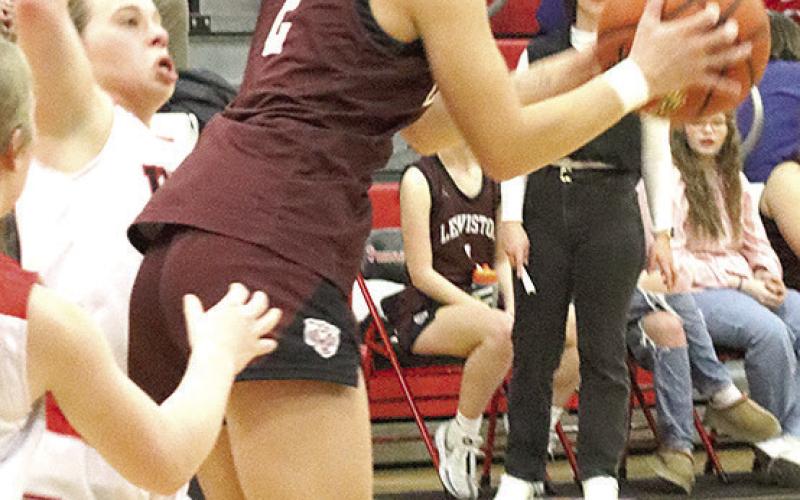LHS’ Justice Currie (#2, right) pulls in a rebound against Pawnee City last Tuesday night. Paula Jasa/Republican