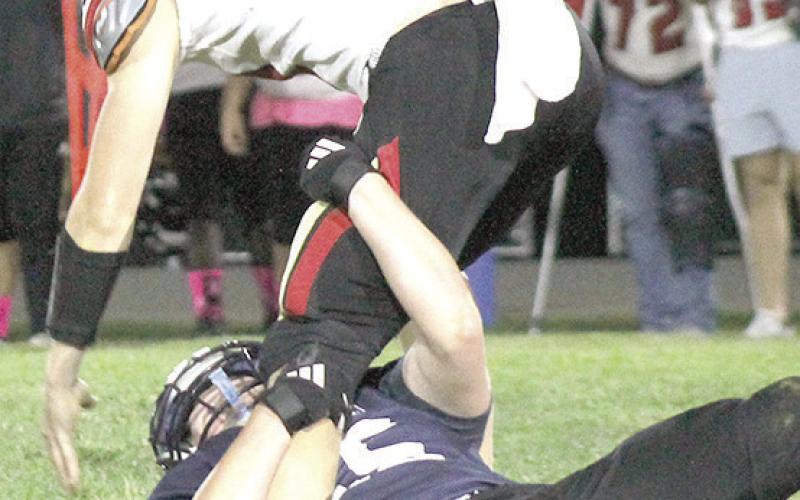 HTRS’ Griffin Sikora (#55, on ground) sacks the JCC quarterback late in the game on Thursday. Paula Jasa/Republican