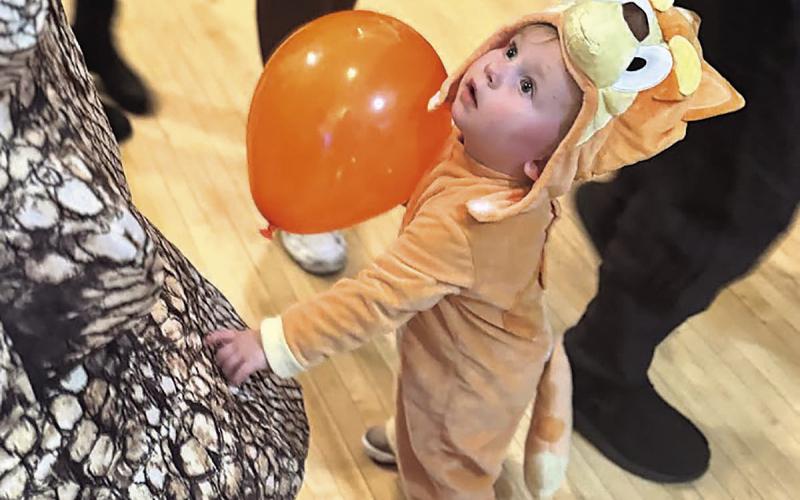 Zoey Rohrs of Du Bois (She’s checking out the dinosaur next to her to see if it is real!)