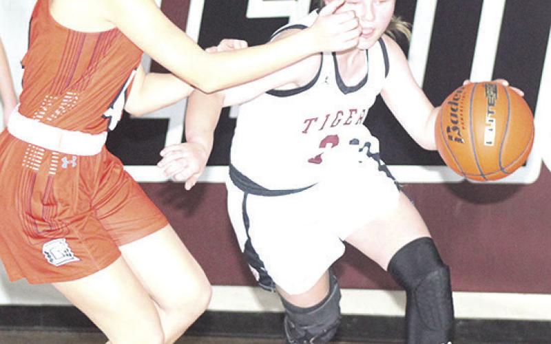 LHS’ Ayden Hunzeker (right) moves the ball up the floor against a Diller/Odell defender. Paula Jasa/Republican